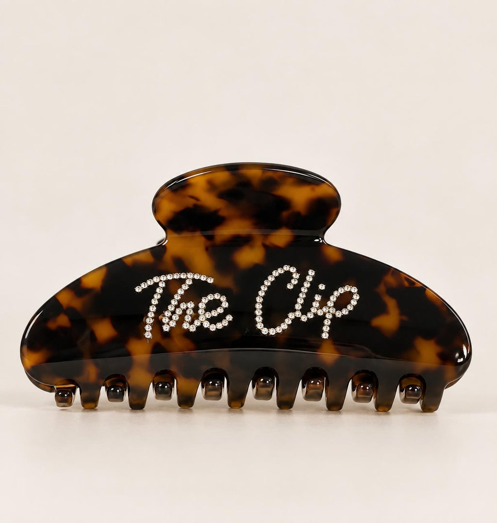 Clema de par The Clip din acetat tortoiseshell, cu logo Dollie din cristale